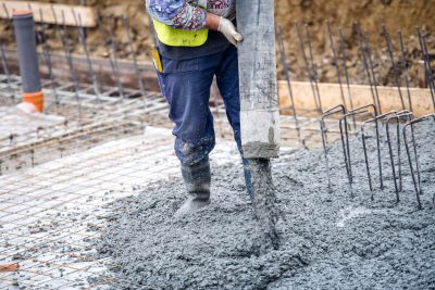 Concrete Foundation with Worker